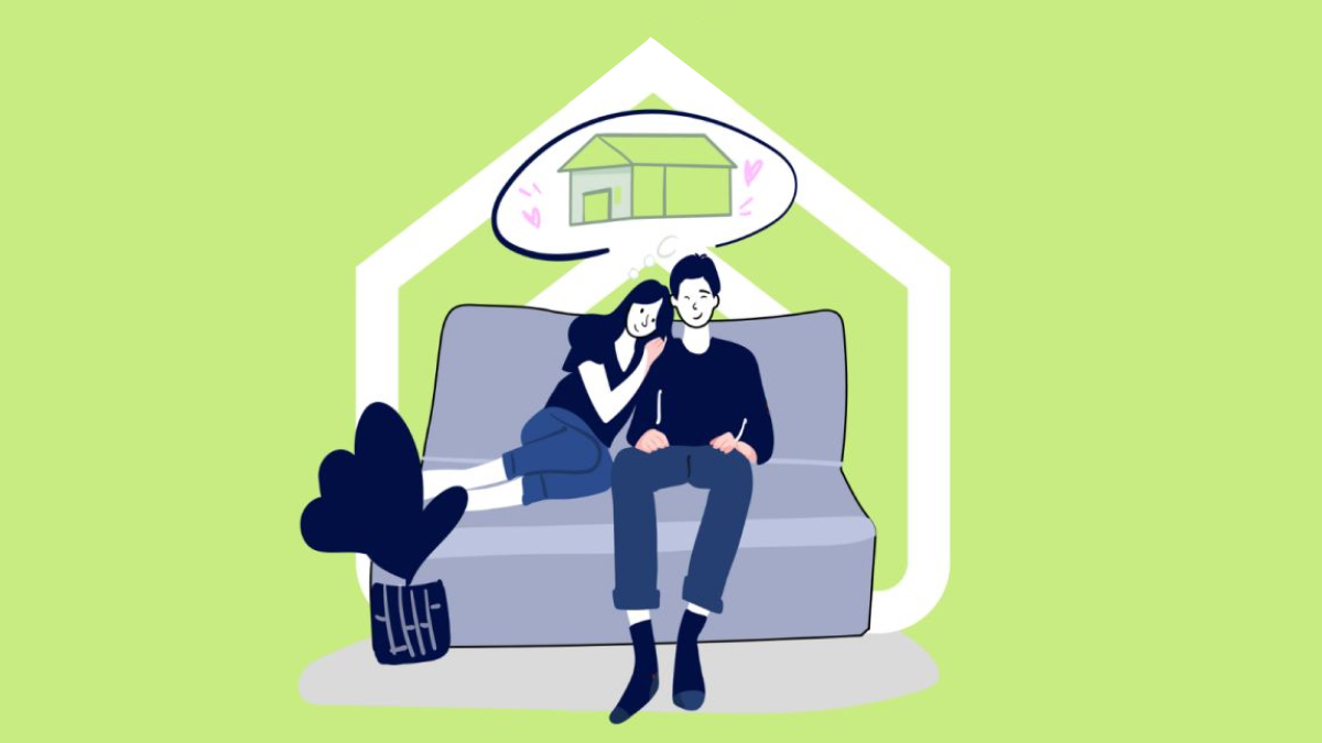 A young couple sitting on a lounge thinking about their first home